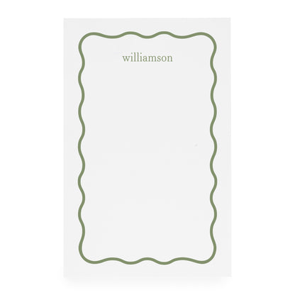 White notepad with green scallop border and 'williamson' in green ink