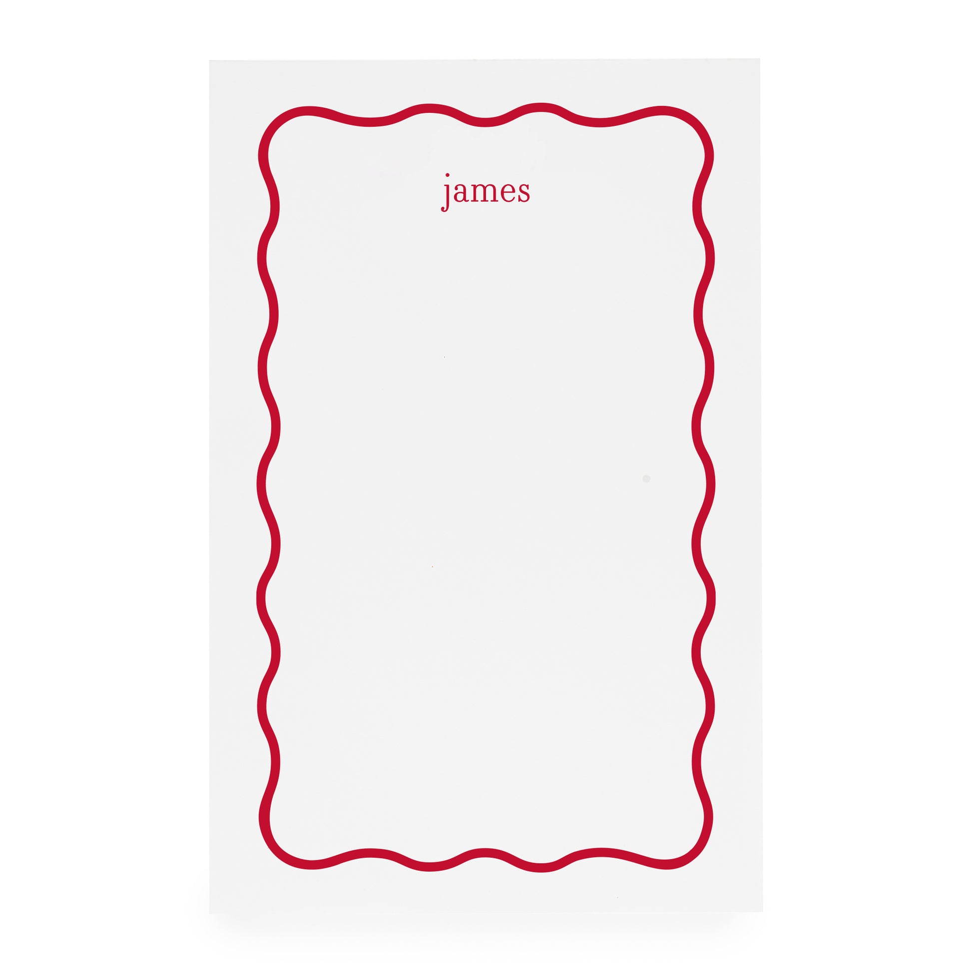 White notepad with red scallop border and 'james' text