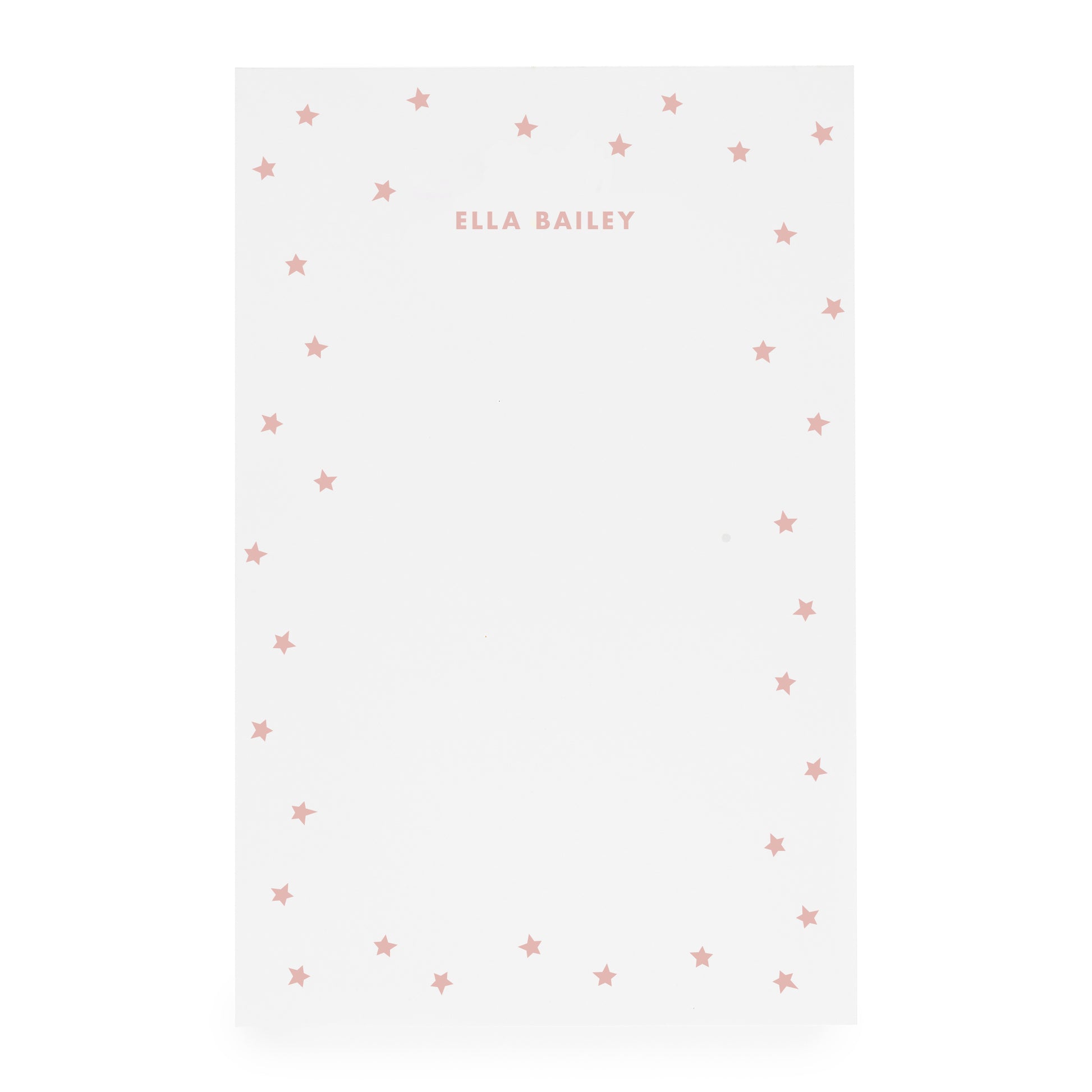 White notepad with scattered star bordered and 'ella bailey' text in rose ink