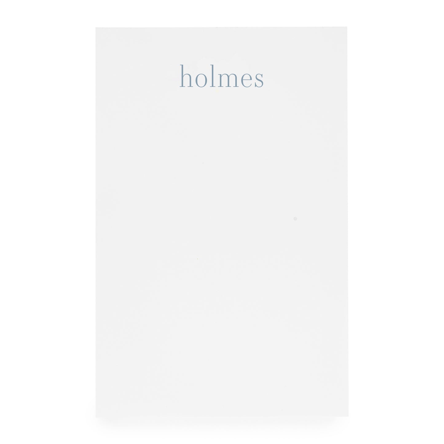 white notepad with blue 'holmes'