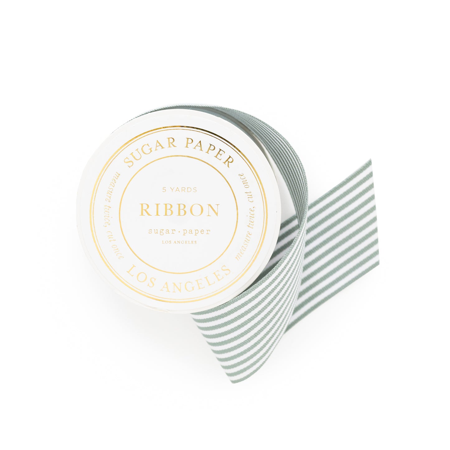 Packaged green and white stripe ribbon spool with 'Sugar Paper' on label