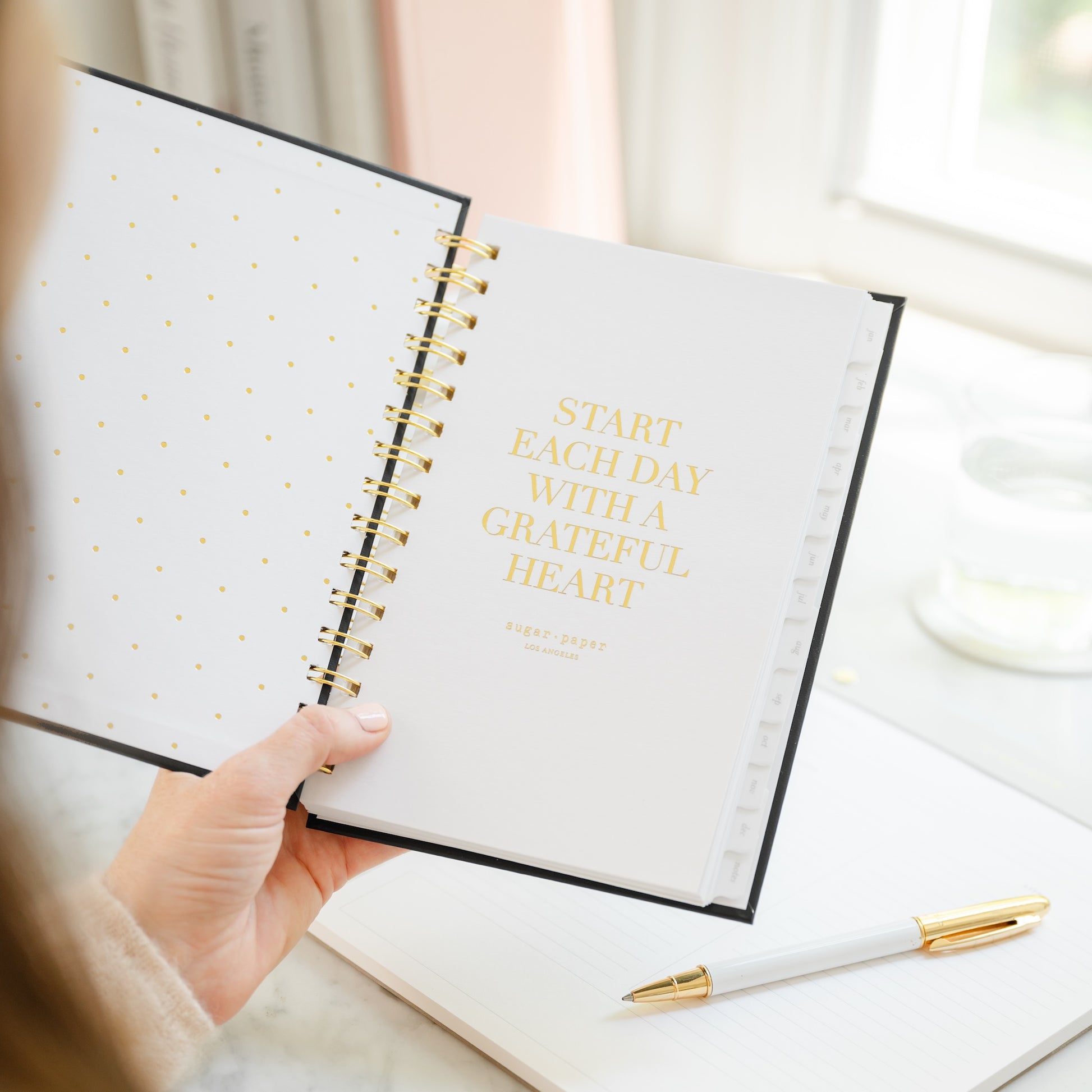 Small planner open to start each day with a grateful heart