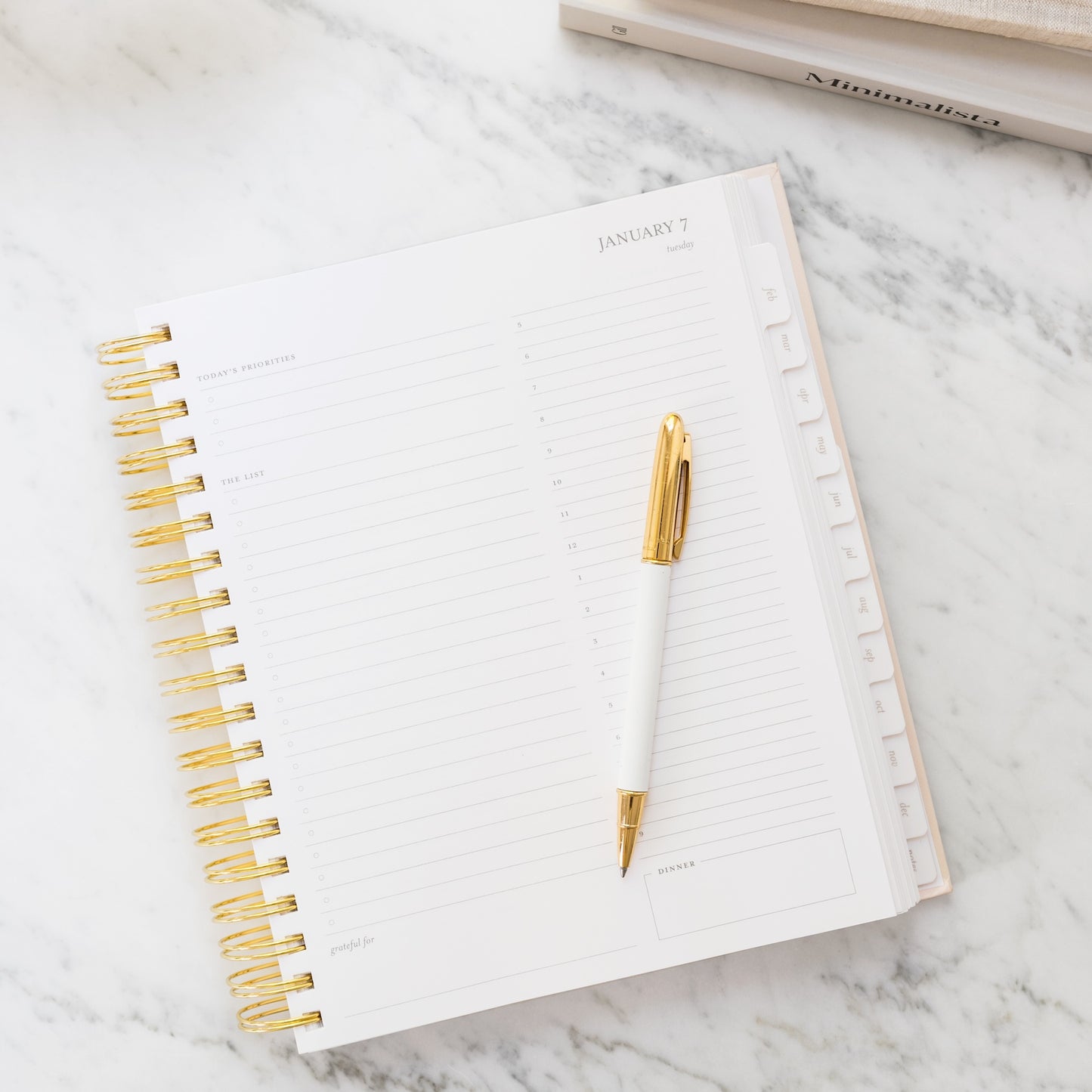 Open daily planner page with pen