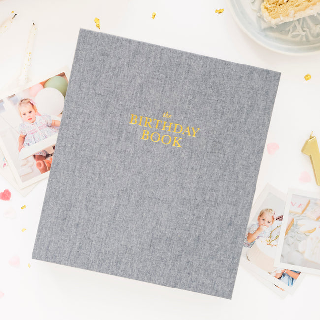 Chambray fabric book foil stamped in gold with The Birthday BOok