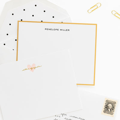 Personalized stationery note cards with 'penelope miller' with a gold border and 'allie fazende' in gold foil with a pale pink heart