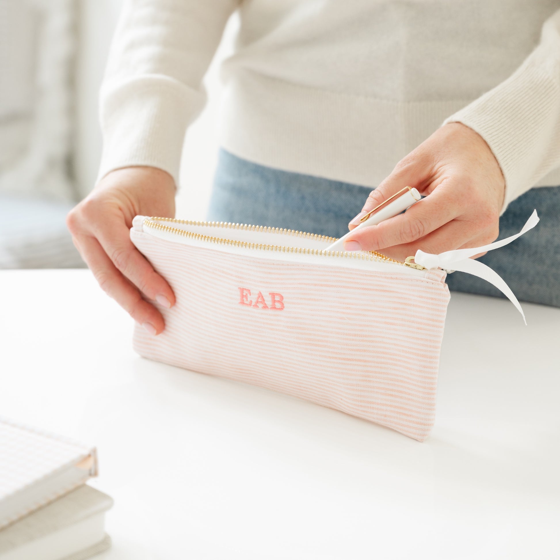 Pink stripe pencil pouch with 'EAB' initials in pink embroidery
