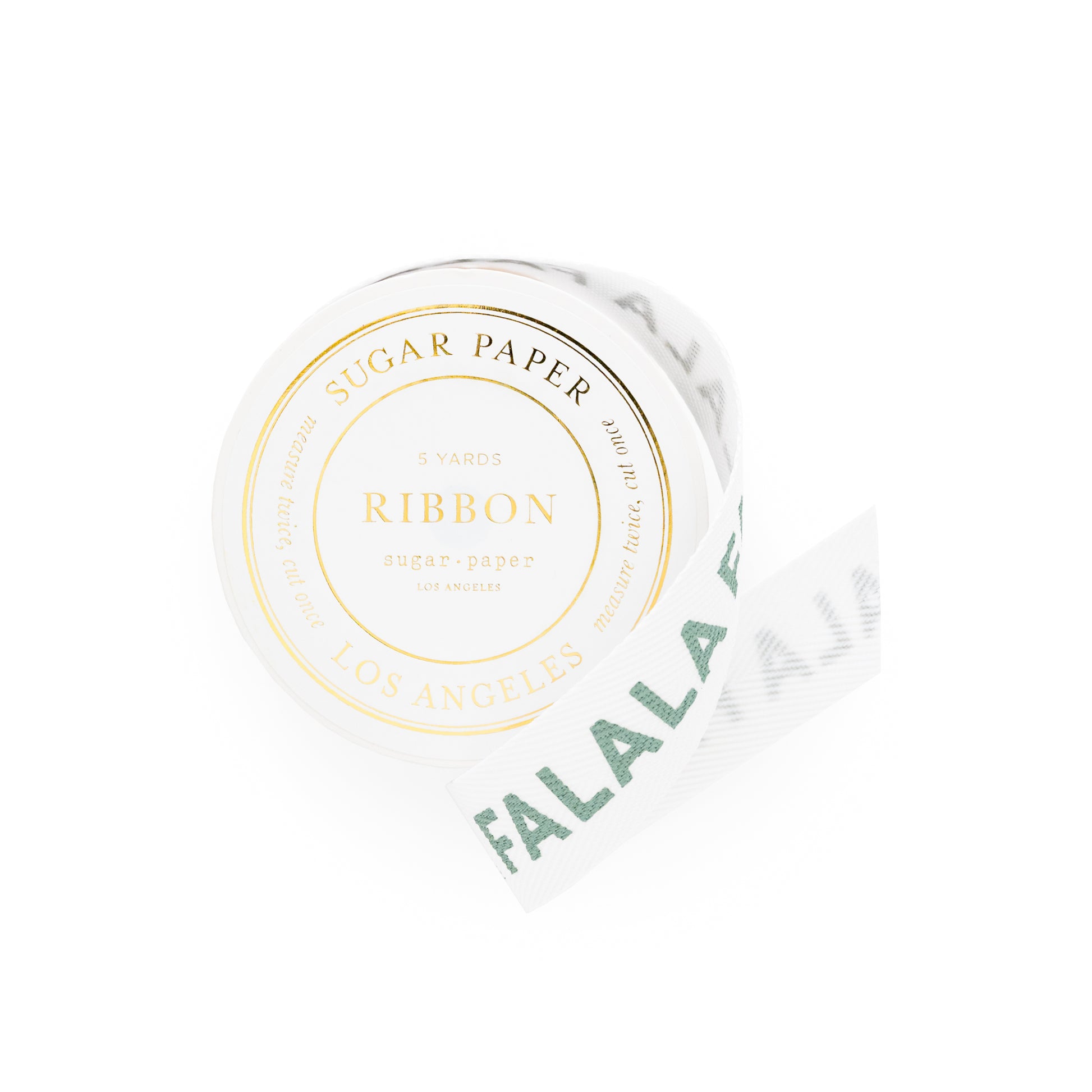 Roll of white ribbon with 'Sugar Paper' and 'Falalala' printed in green on ribbon