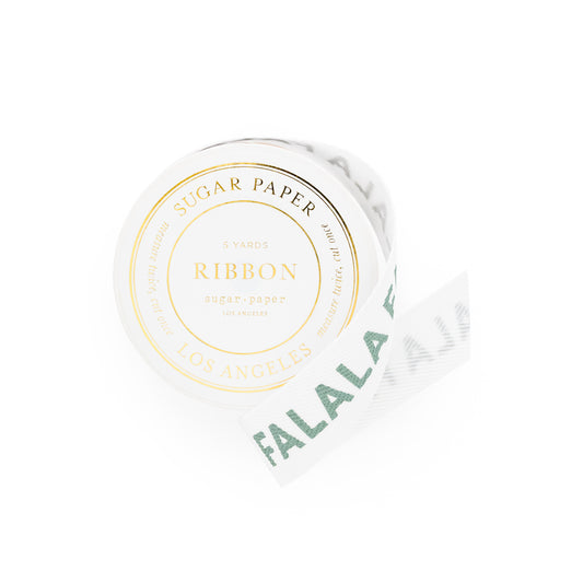 Roll of white ribbon with 'Sugar Paper' and 'Falalala' printed in green on ribbon