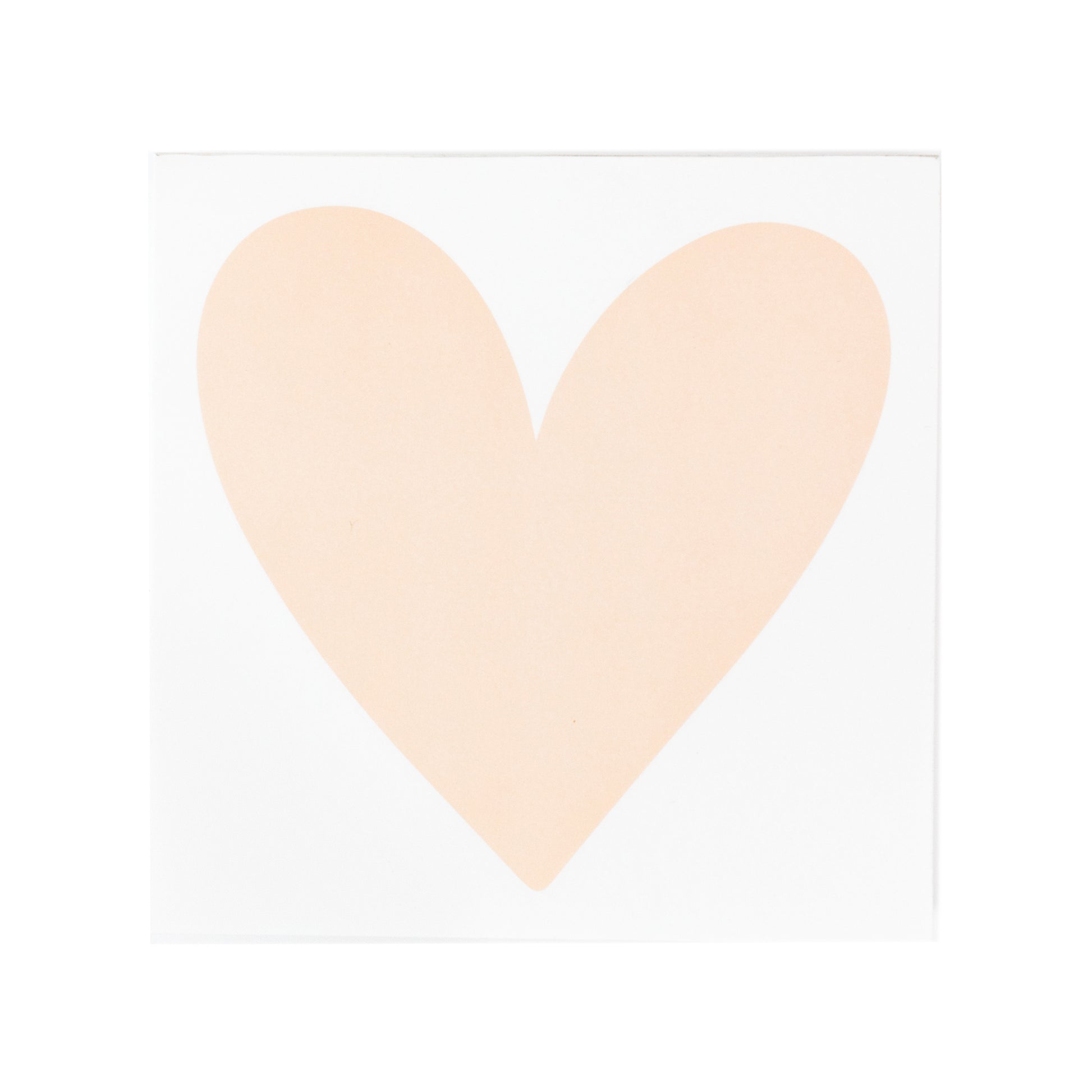 white notepad with pale pink heart