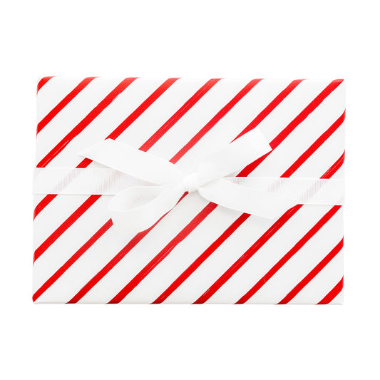 Red and white stripe wrapped package with white ribbon