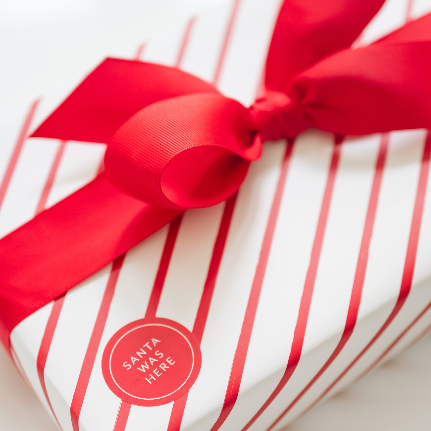 red stripe gift wrap with santa was here sticker