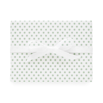 white and green dot wrapping paper wrapped gift with white bow