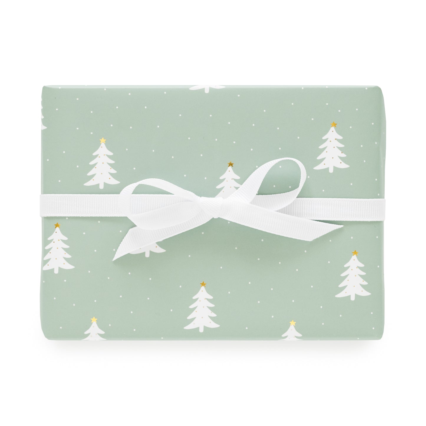 Green wrapping paper with white and gold christmas trees and white ribbon bow