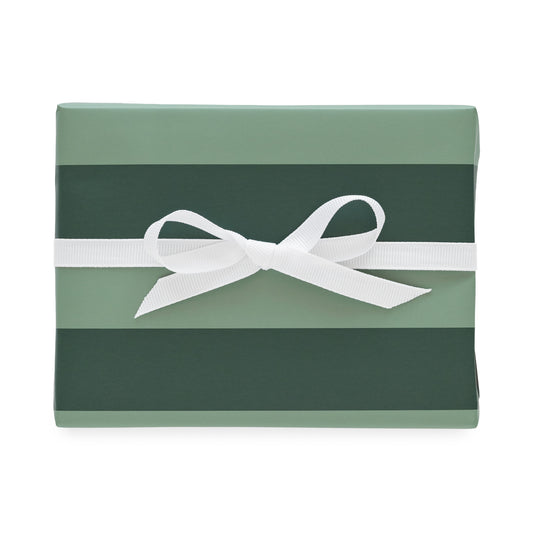 Mint and dark green wrapping paper wrapped on a gift with a white ribbon