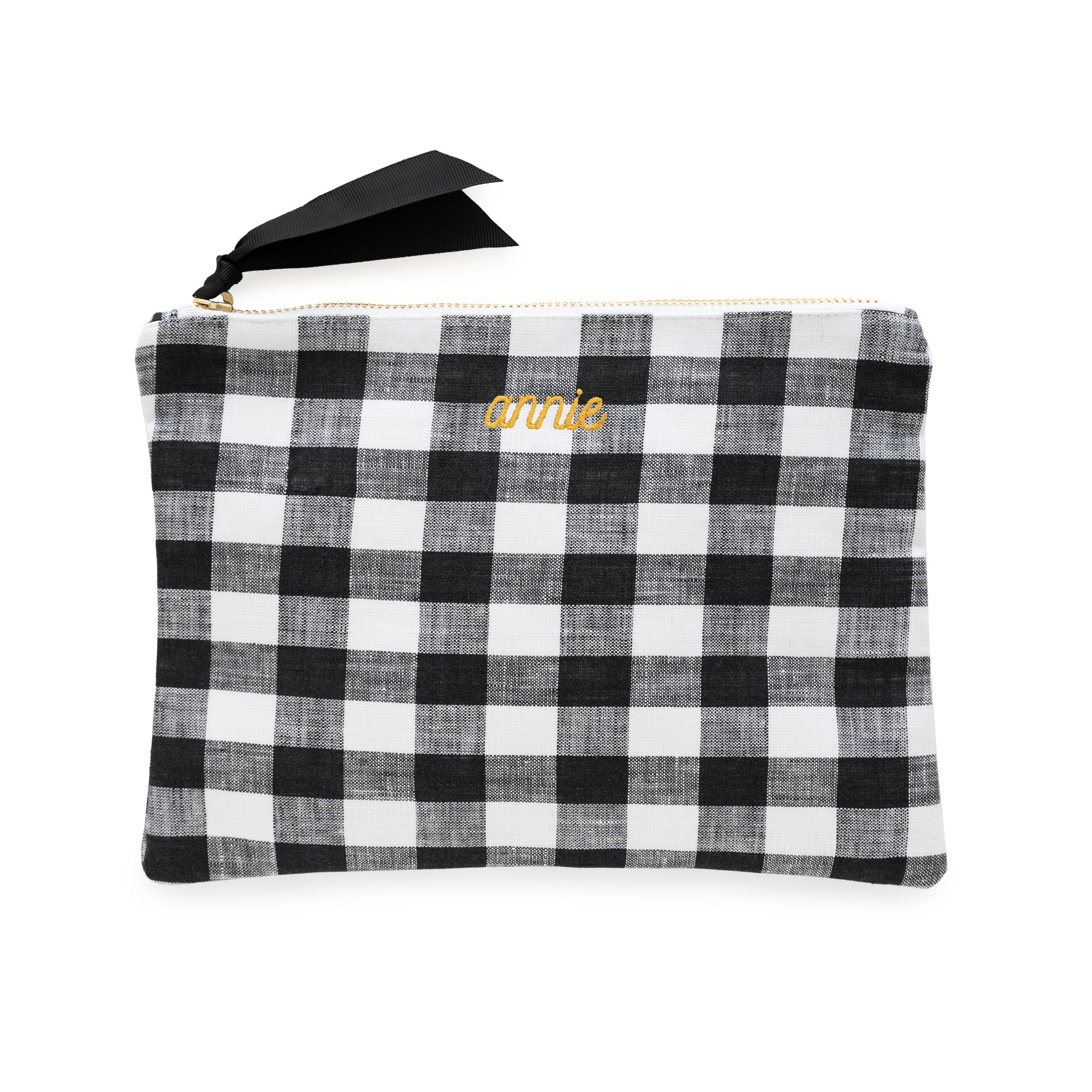 Black and white checkered pouch with 'annie' in mustard