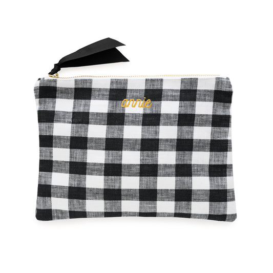Black and white checkered pouch with 'annie' in mustard