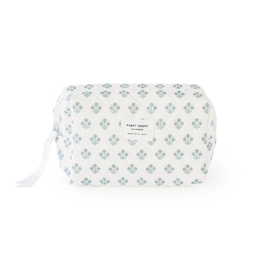 White pouch with blue floral pattern on a white background