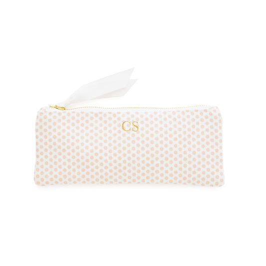Pink polka dot pouch with gold foil initials and gold zipper and white ribbon