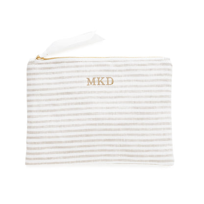 Striped pouch with 'MKD' monogram on a white background