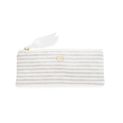 Flax and white striped pouch with gold zipper, white ribbon pull, and gold initials