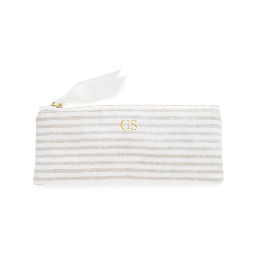 Flax and white striped pouch with gold zipper, white ribbon pull, and gold initials