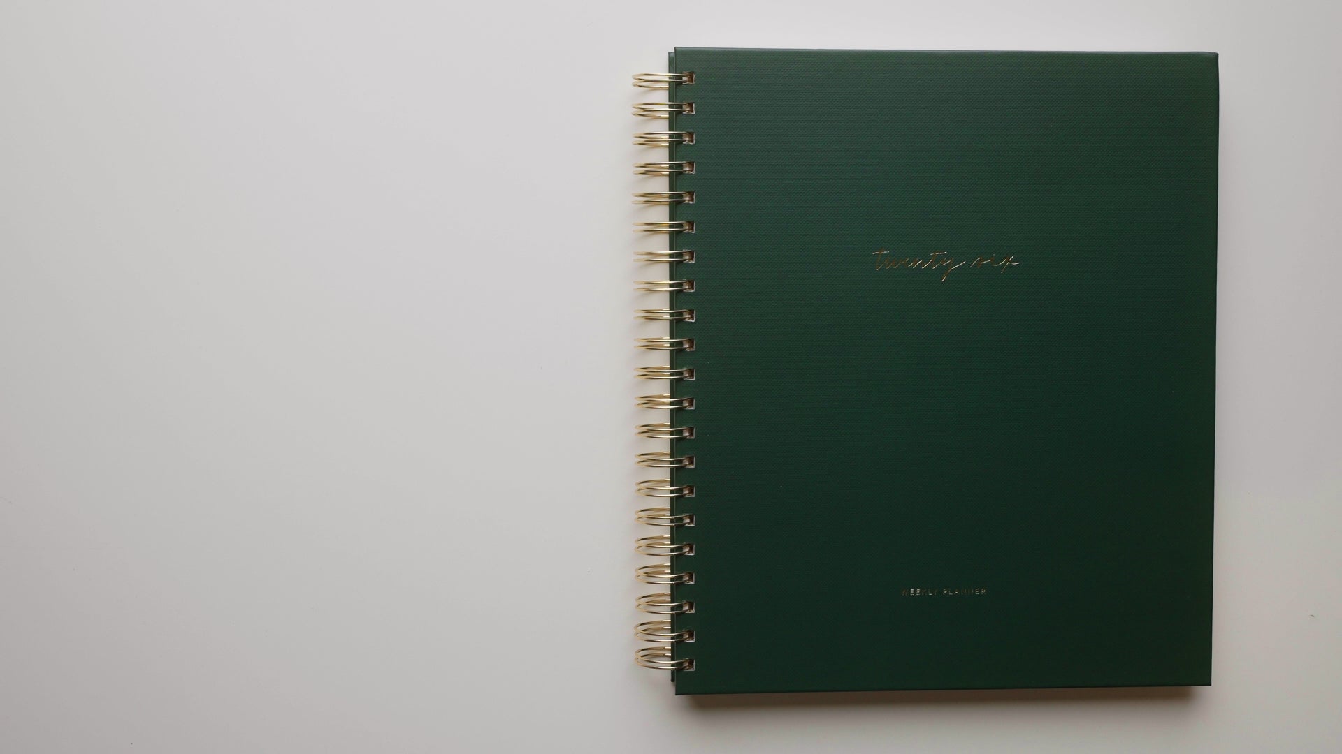 Load video: video showing the interior 2026 large weekly spiral planner in green 