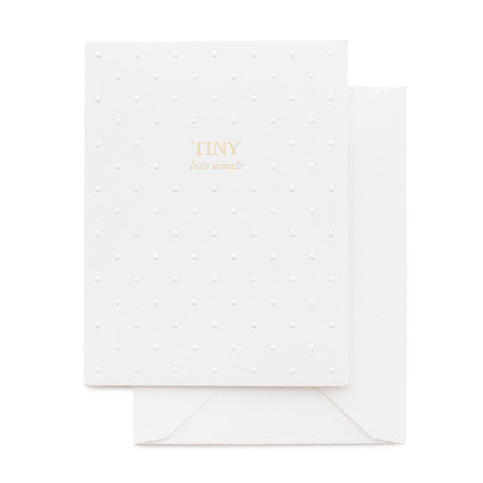 White with embossed dot baby card printed with Tiny Little Miracle in gold foil