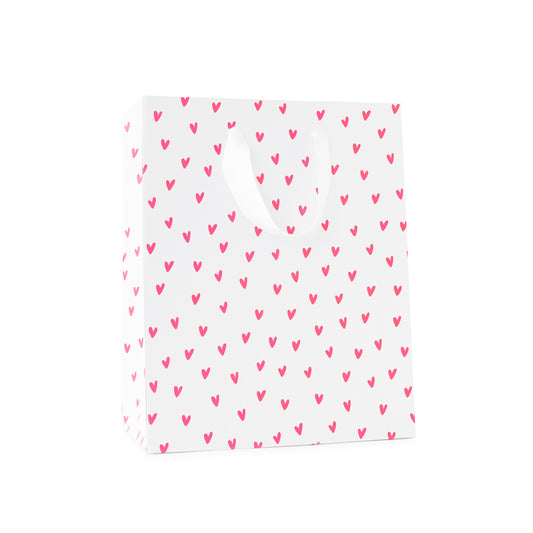 Pink neon heart gift bag with white handles