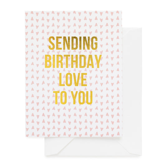 white card with pink heart pattern and gold foil text, white envelope