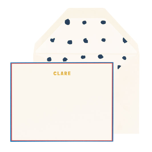 cream card with red and navy border and gold text, cream envelope with navy dotted liner