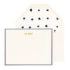 cream card with red and navy border and gold text, cream envelope with navy dotted liner