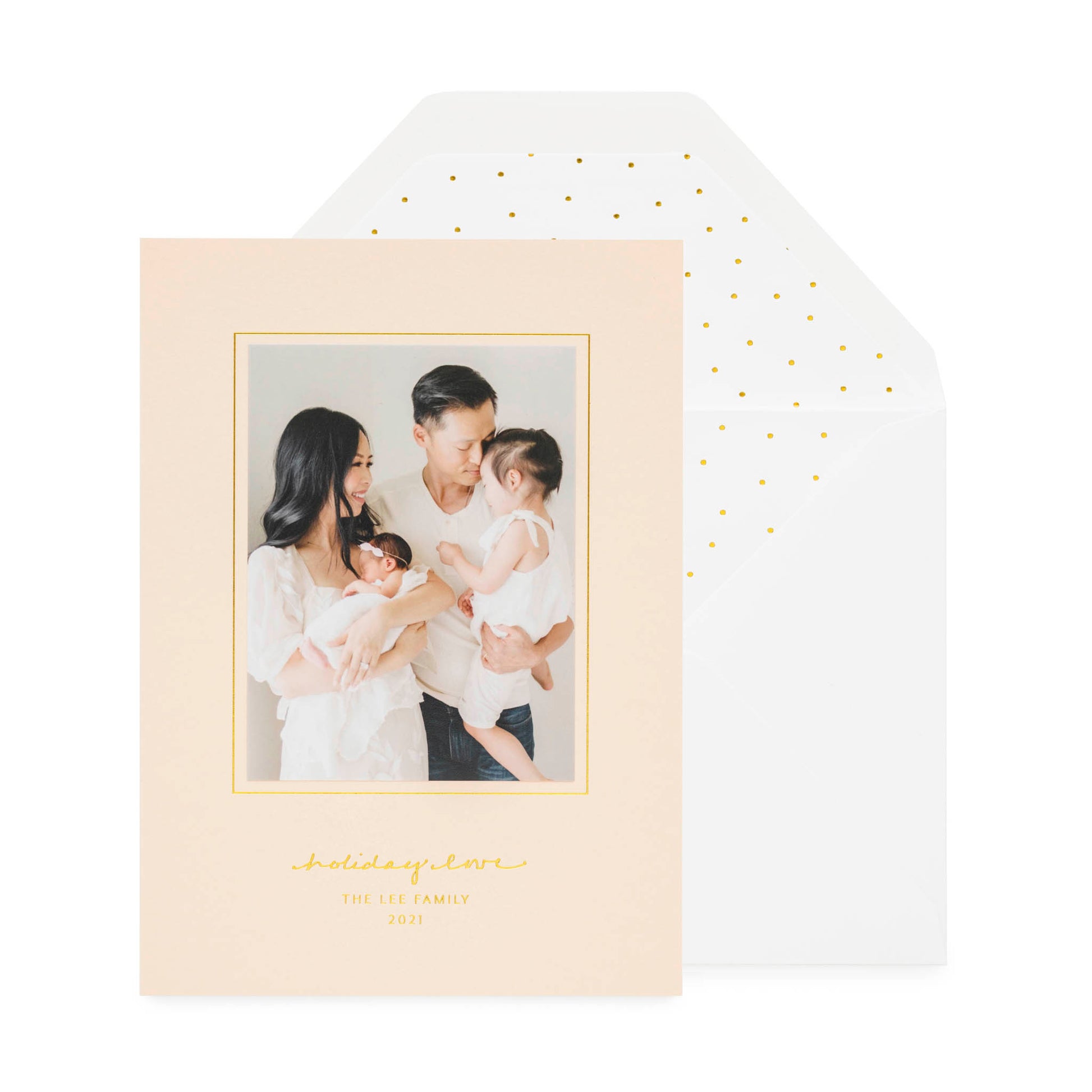 pale pink card with photo and gold text, white envelope with gold scatter dot liner