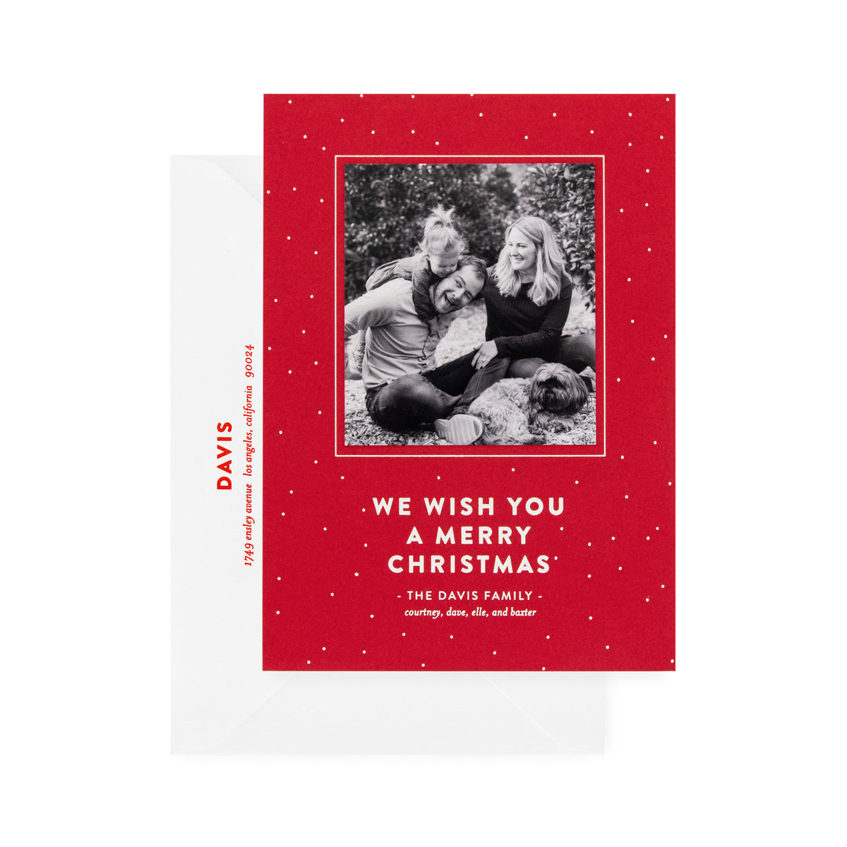 red card with photo, white dots and white text, white envelope with red text