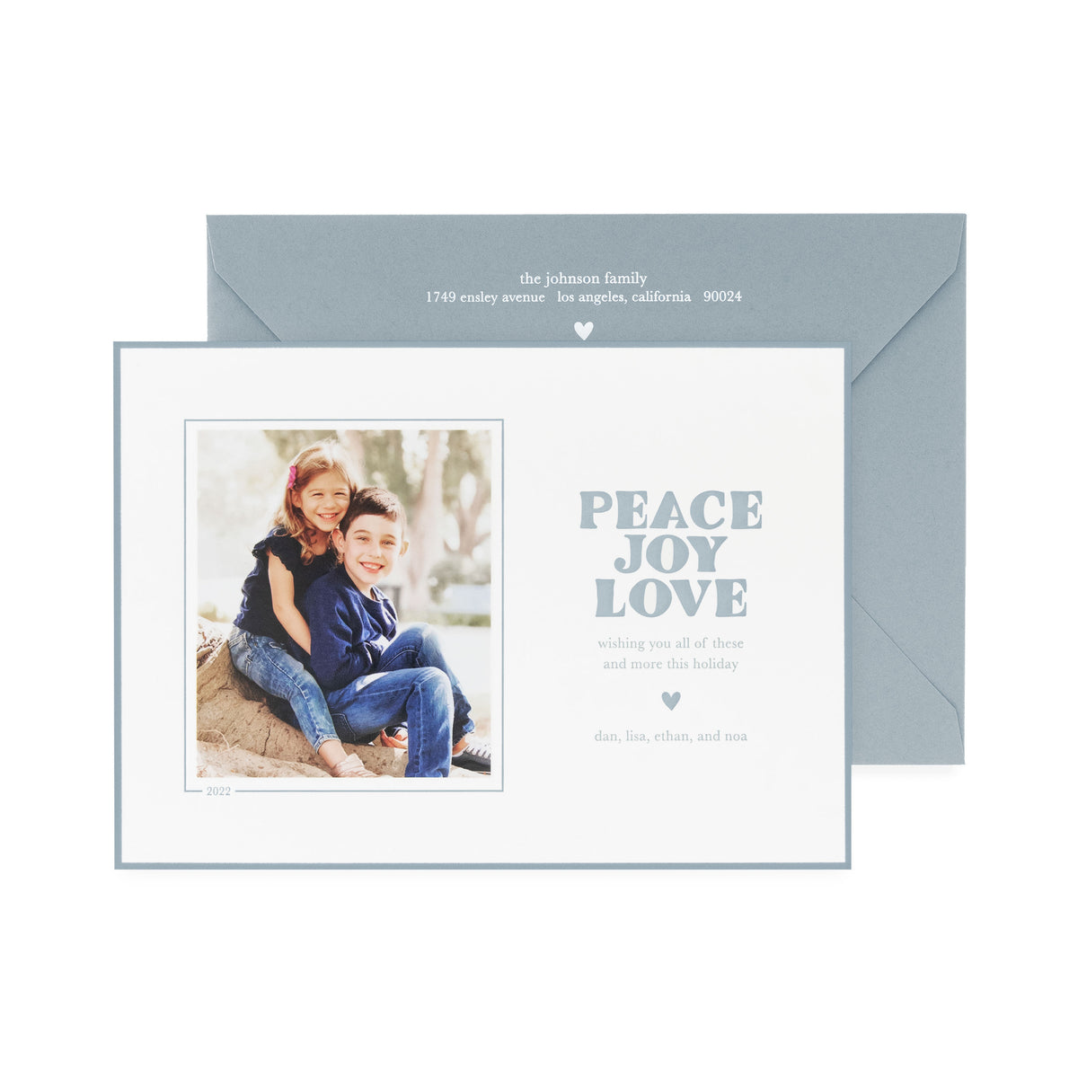 white card with photo and slate blue text, slate blue envelope with white text