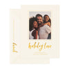 cream card with photo and gold text, cream envelope with gold text