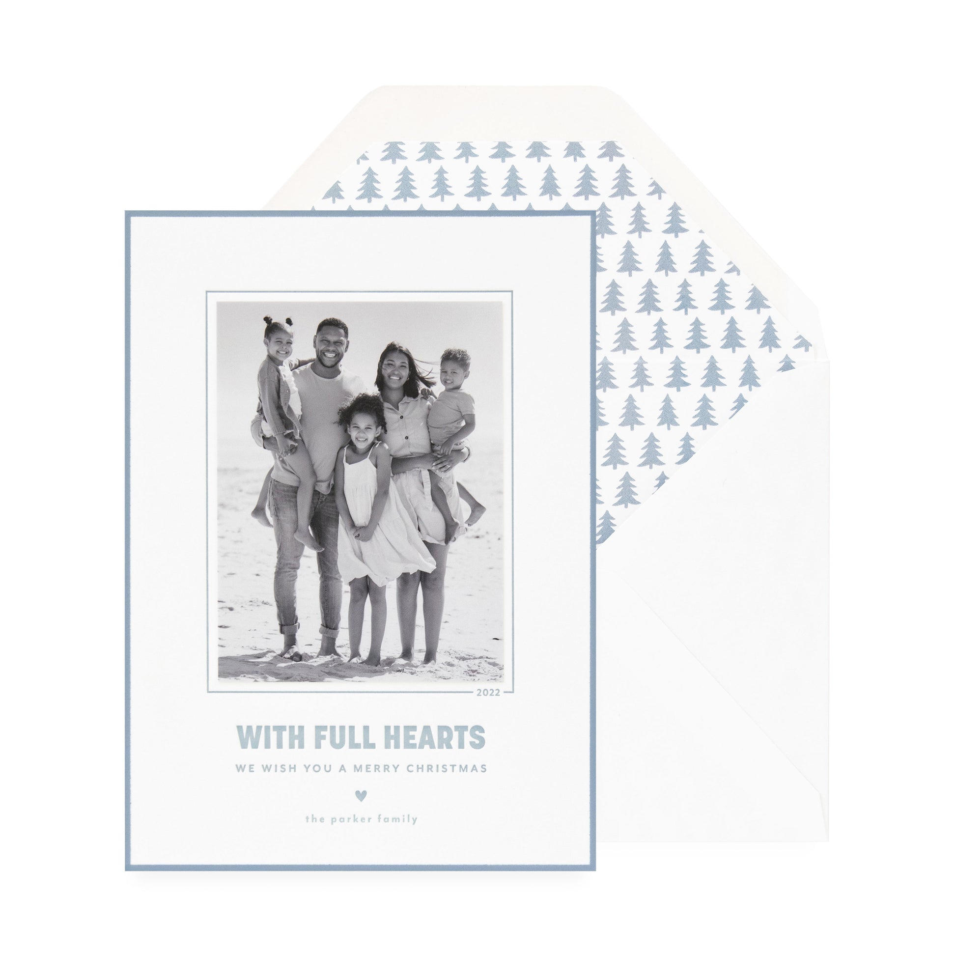 white card with photo, slate blue text and border, white envelope with blue tree liner