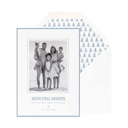 white card with photo, slate blue text and border, white envelope with blue tree liner