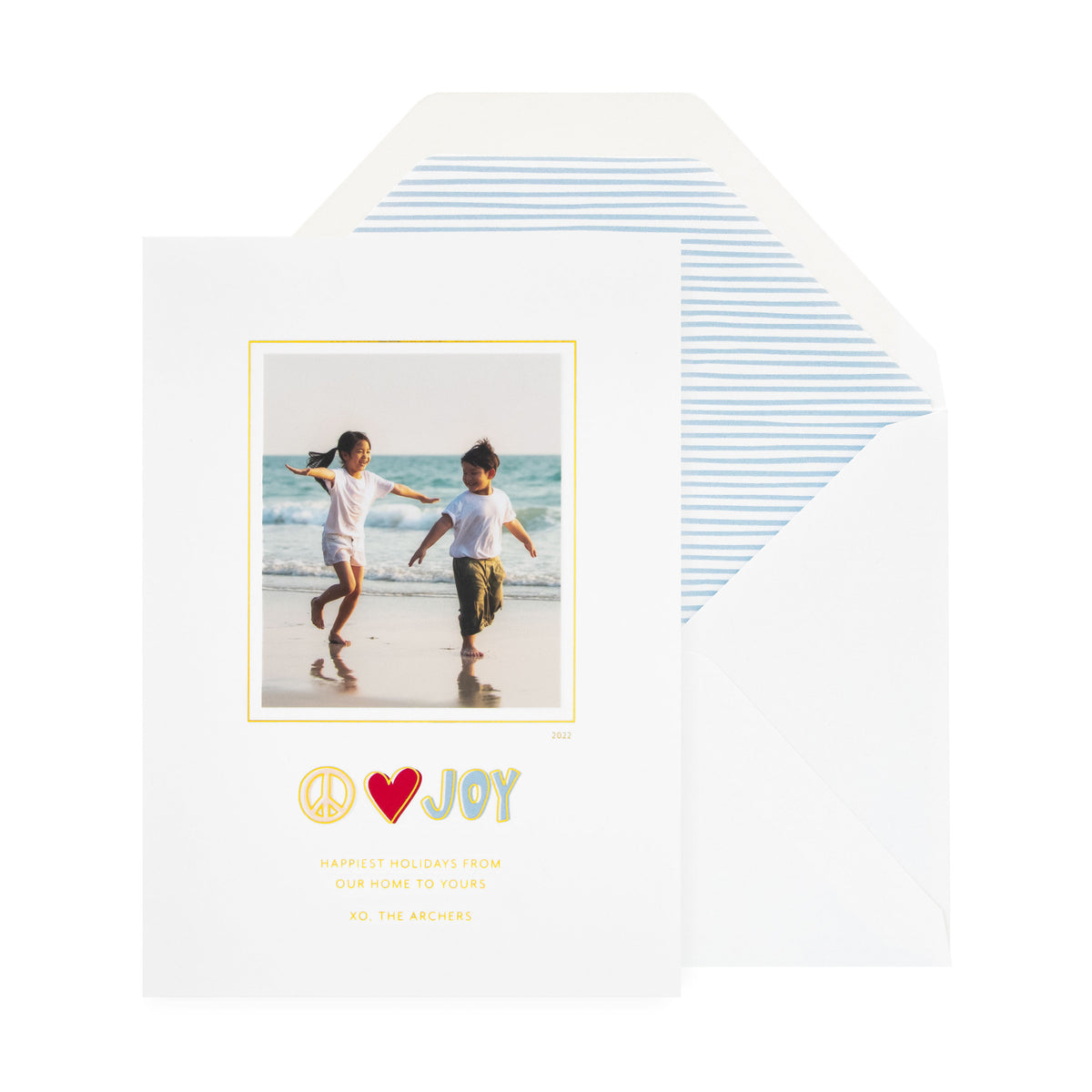 white card with photo, multicolor text, white envelope with blue painted stripe liner