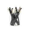 Jar of black pens with white dot