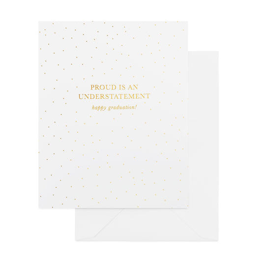 white card with gold foil pindots and "proud is an understatement, happy graduation!" in gold foil, white envelope