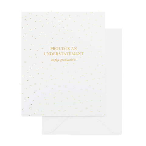 white card with gold foil pindots and "proud is an understatement, happy graduation!" in gold foil, white envelope
