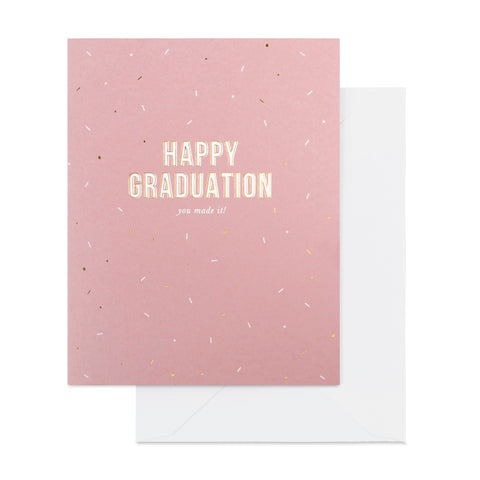 Dusty rose card with confetti printed with Happy Graduation You Made It