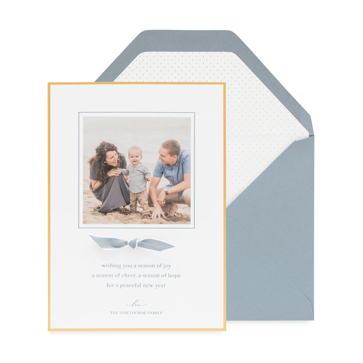 Blue and gold holiday photo card paired with a blue and white ribbon