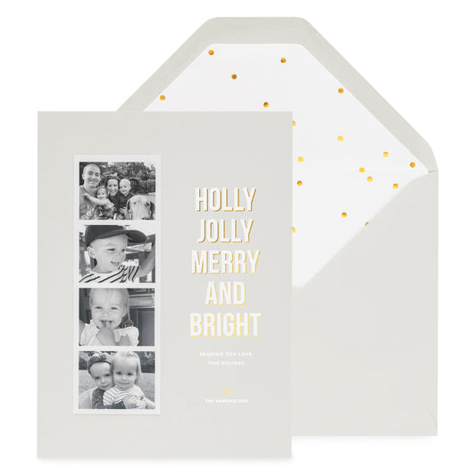 Grey holiday photo card with photo strip with Holly Jolly Merry and Bright