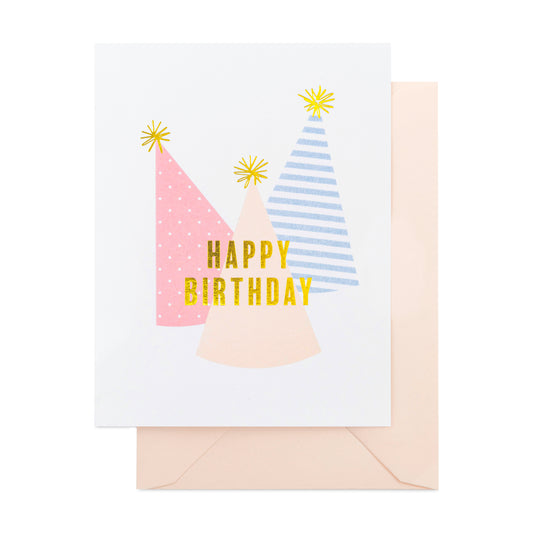 Colorful party hats printed with happy birthday in gold foil