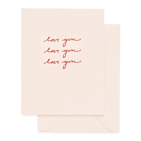 pale pink card with red foil love you script, pale pink envelope
