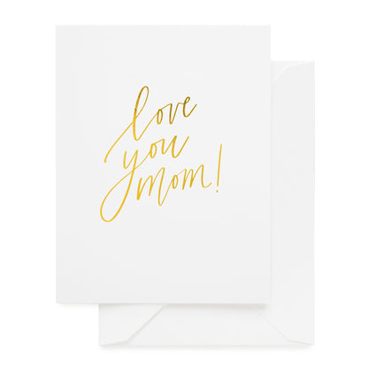 white card with gold text, white envelope