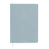 dusty blue journal with gold foil monogram