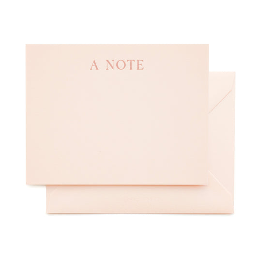 pale pink paper with rose text and pale pink envelope