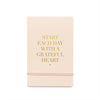 pale pink mini note pad with gold foil "Start Each Day With a Grateful Heart" and pink elastic band